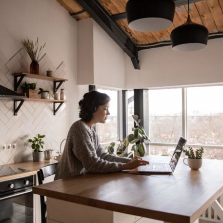 Young professional working from their kitchen table