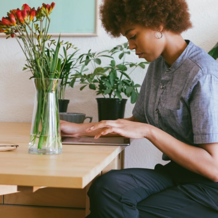 A professional setting up their desk at home