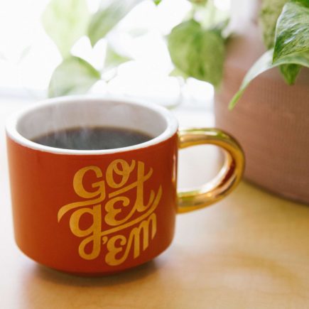 Mug on the desk of side hustle manager during lockdown