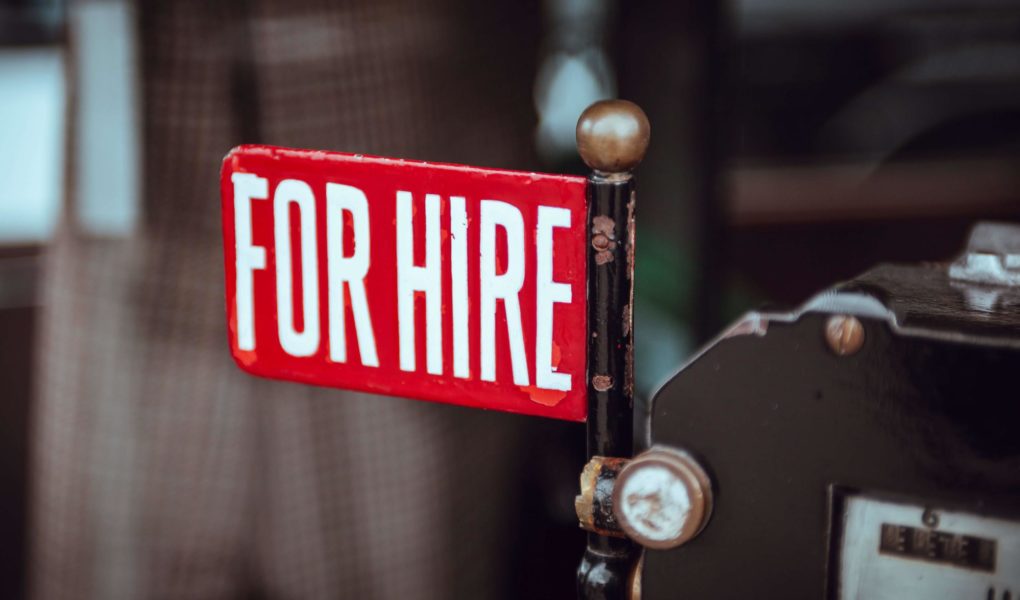 For hire sign displayed by a job hunter