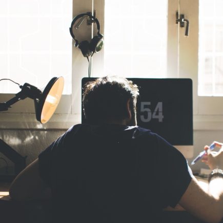 Remote employee working from home in a small office space.