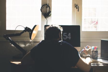 Remote employee working from home in a small office space.
