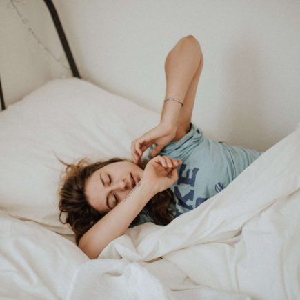 Woman harnessing sleep to ease her mental health concerns